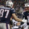 Tom Brady giving high five to Gronkowski
